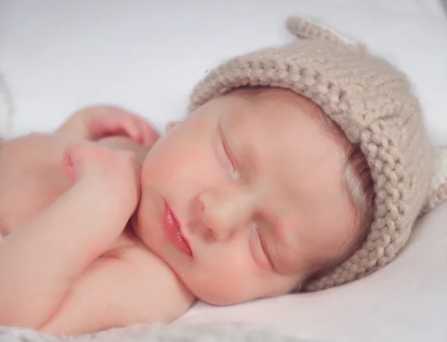 Newborn portrait in a soft bear hat